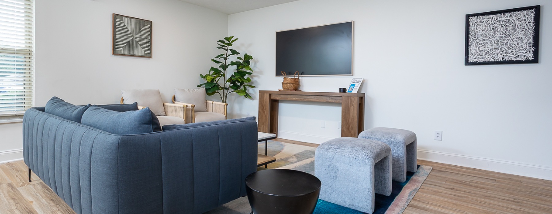 Room with computer, tables, and tv