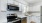 Open kitchen with white cabniets 