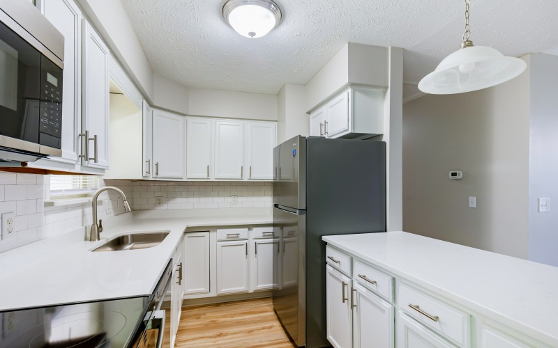Kitchen with white cabinets and stainless steel appliances