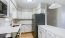 Kitchen with white cabinets and stainless steel appliances