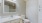 Bathroom with white walls and cabinets 