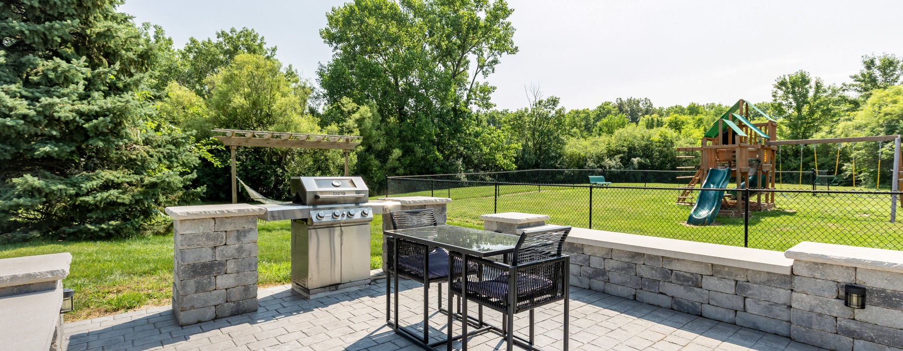 Paved area with grill and dining set