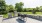 Paved area with grill and dining set