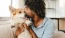 a man holding a dog