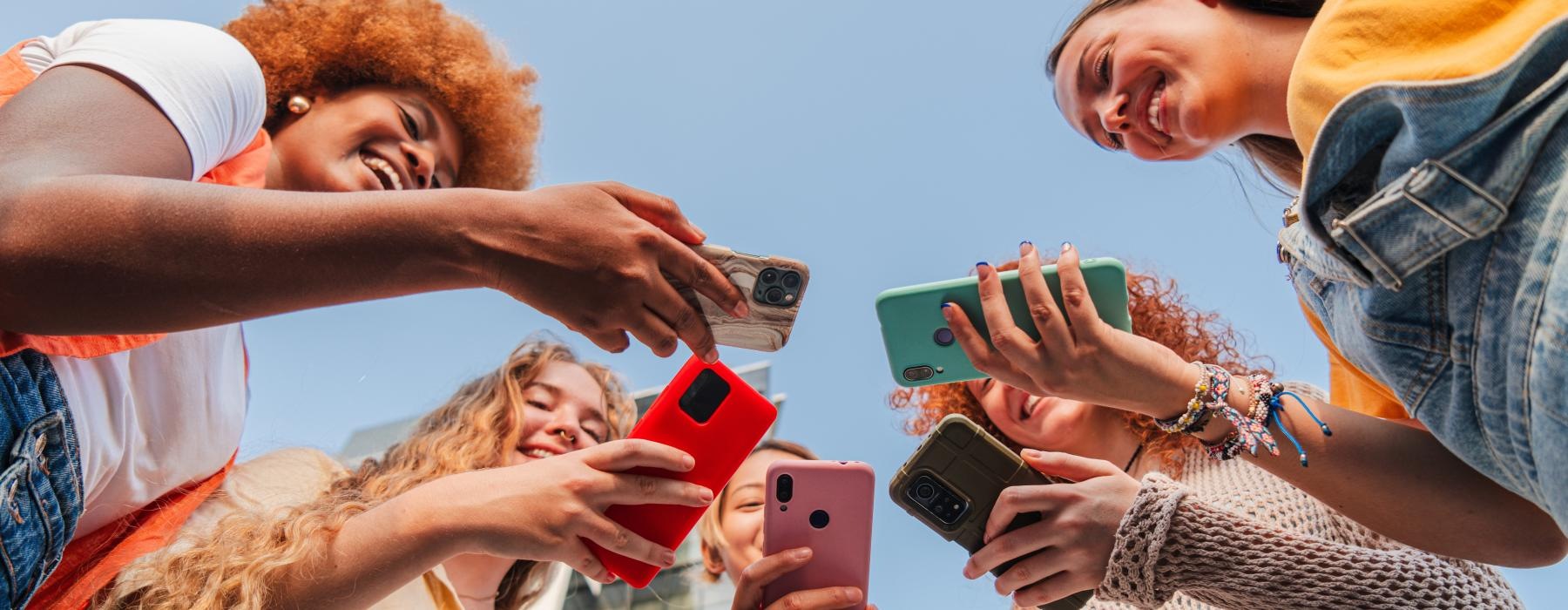 a group of people holding cell phones