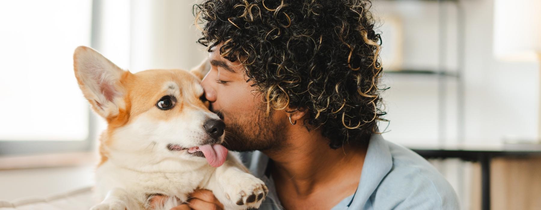 a man holding a dog
