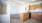 a kitchen with wooden cabinets
